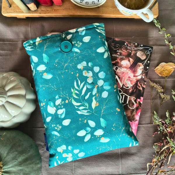 Pochette de livre turquoise à motifs de feuilles blanches et dorées avec bouton